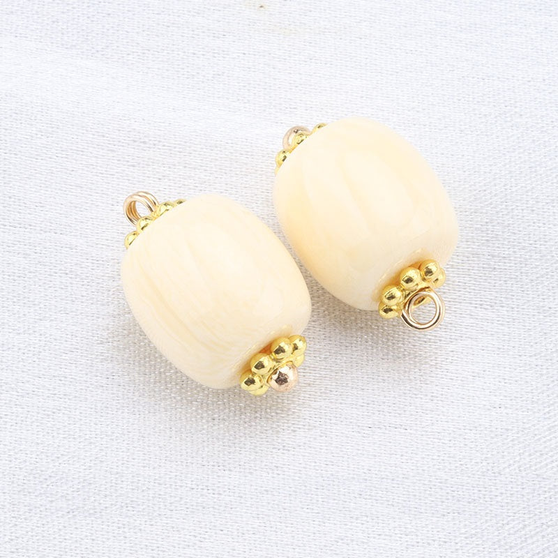 Beige resin frog buttons with gold studs, pair of oval shank buttons