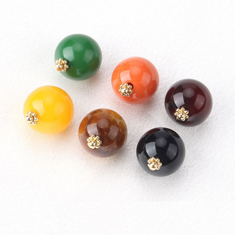 Assorted resin bead buttons: green, orange, yellow, brown, black—flower bases, gold-tone