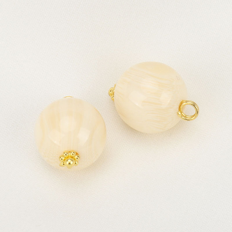 Beige resin bead buttons with flower base, gold-tone loop backs