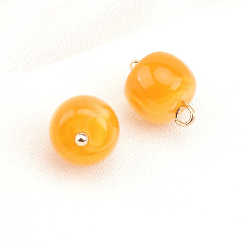 Yellow resin bead button pair with gold stud tops and metal ring backs; Style B.