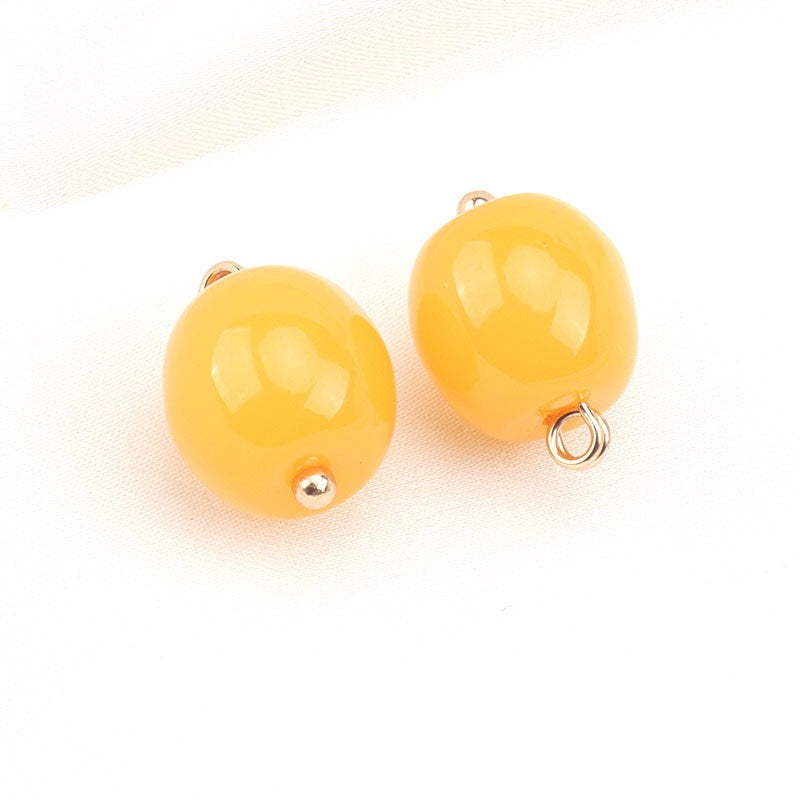 Yellow resin bead buttons with gold stud accents and metal loop backs; Style A.