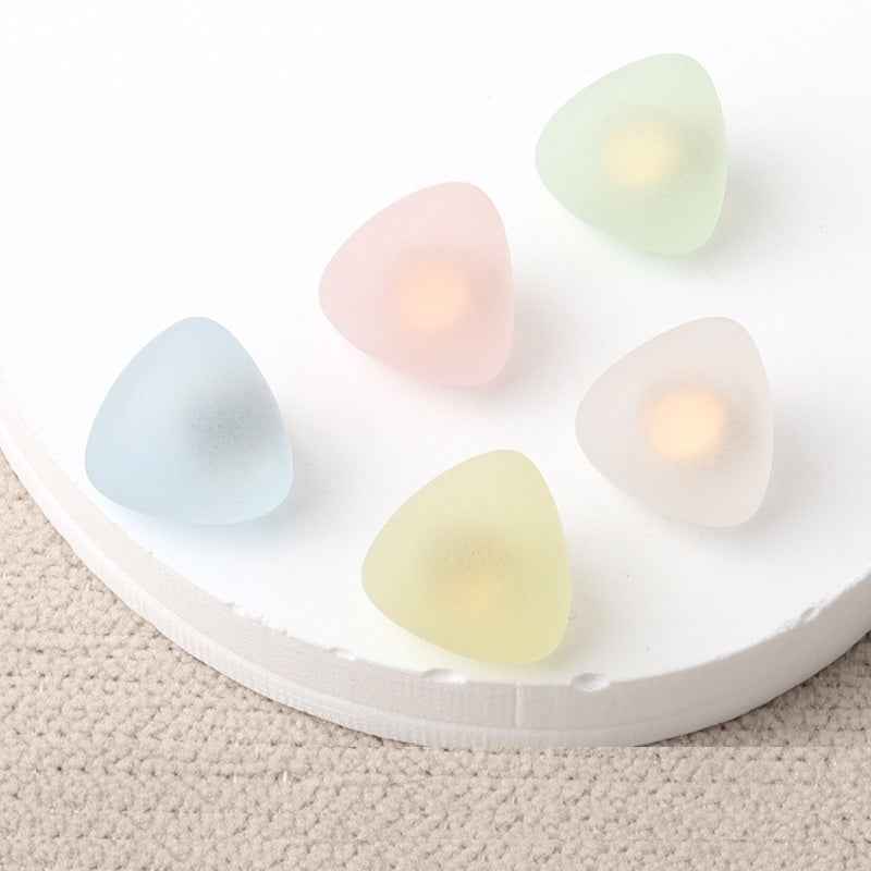 Triangular matte resin shank buttons, pastel mix—flat fronts visible