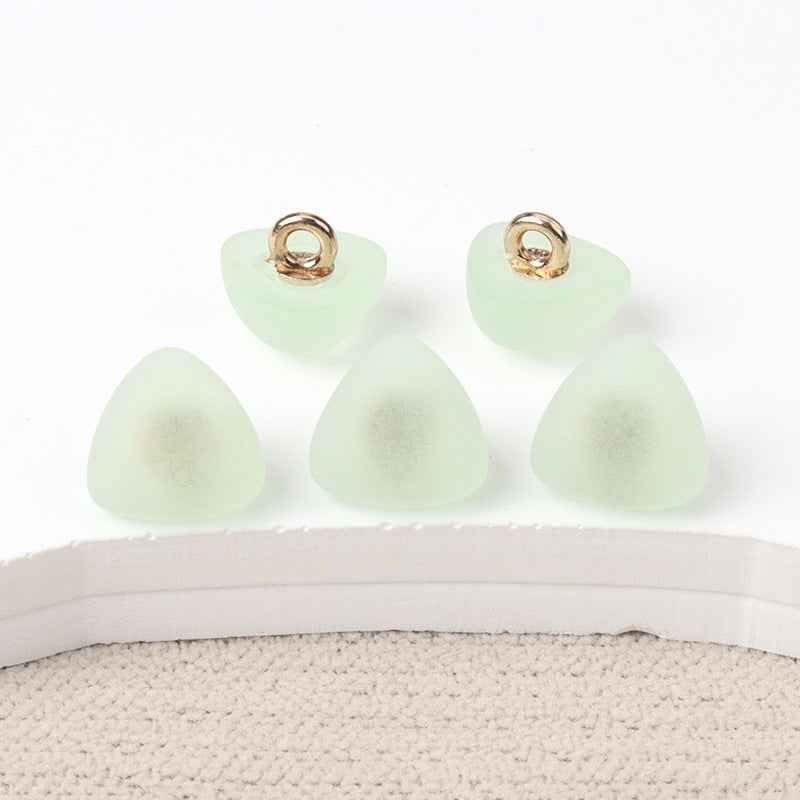 Triangular matte resin shank buttons, mint green fronts with gold-tone loop shank