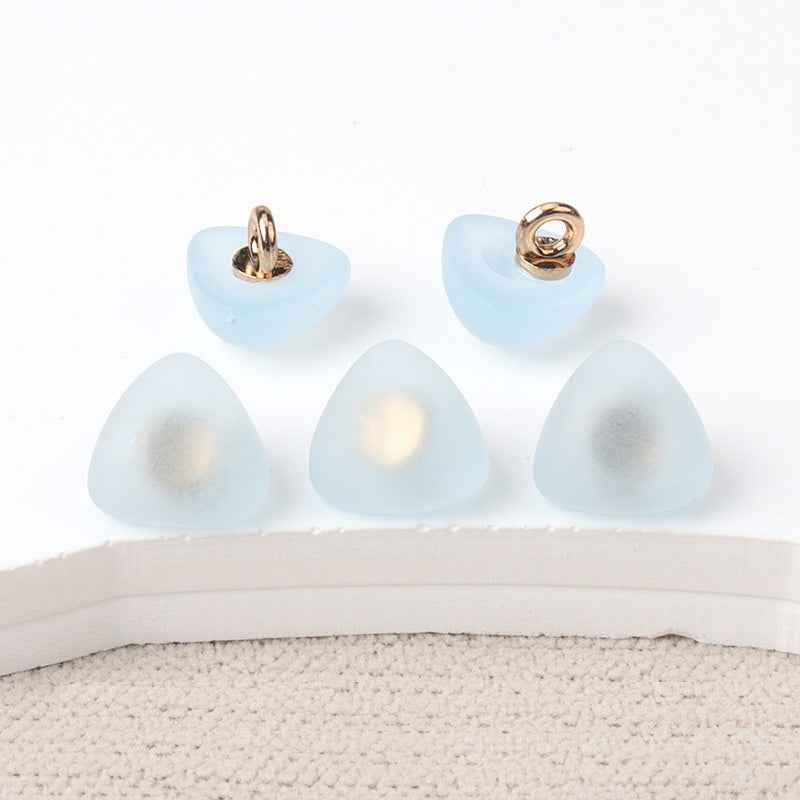 Triangular matte resin shank buttons, light blue fronts with gold-tone loop shank