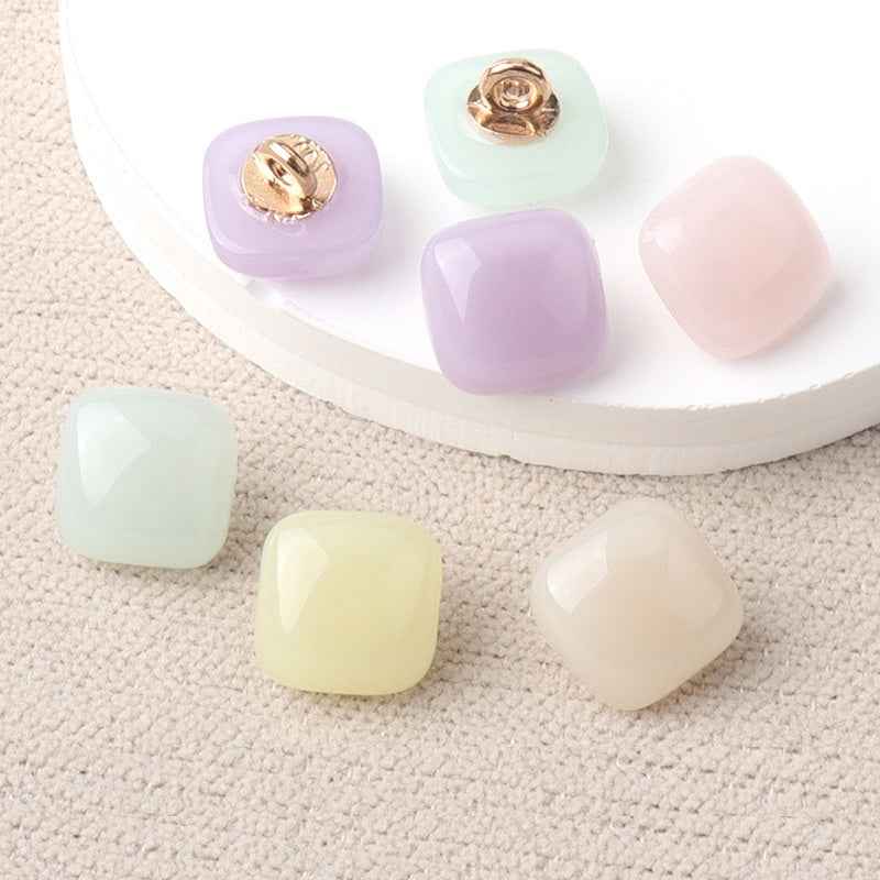 Pastel square resin buttons with gold-tone shanks: purple, mint, blush, cream