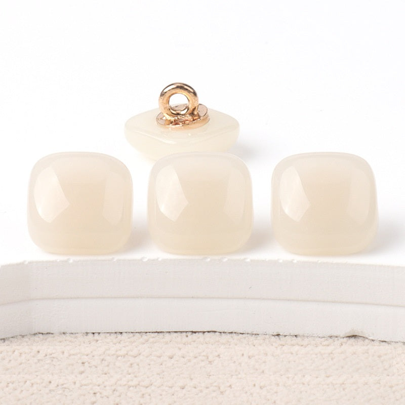 Ivory and cream square resin buttons with gold-tone metal loops