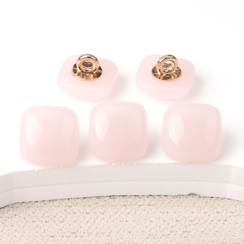 Blush pink square resin buttons with gold-tone shanks, three button fronts