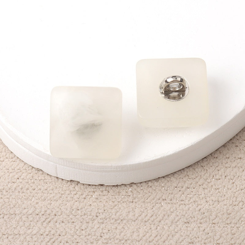 White resin square shank buttons with metal loop, pair view