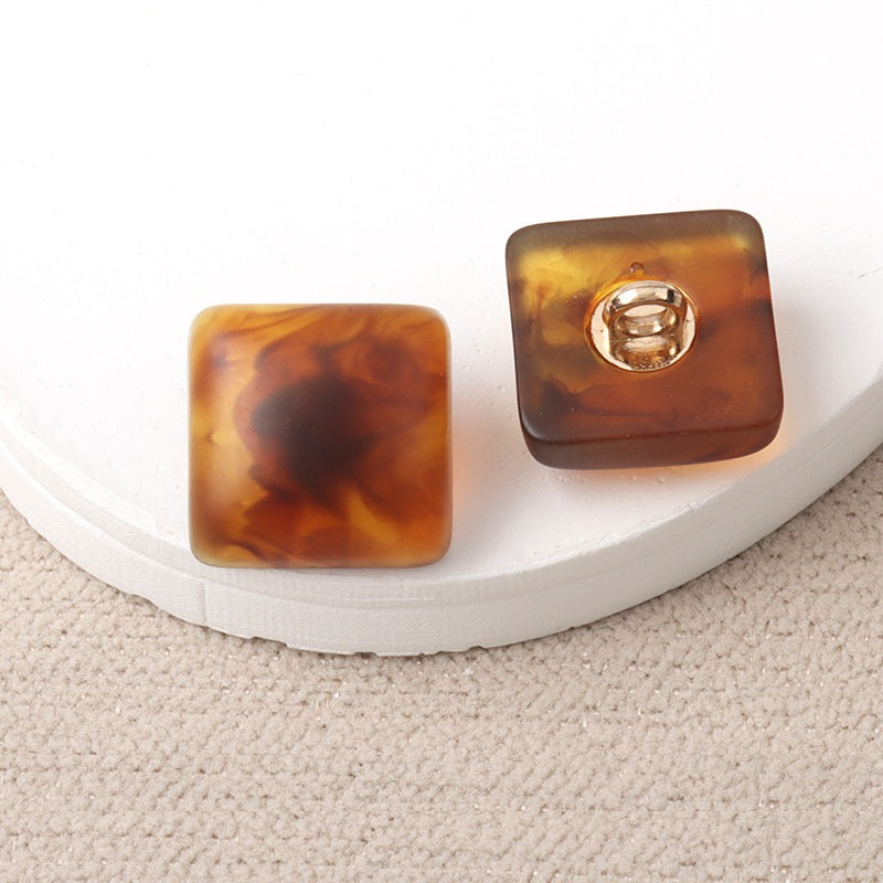 Amber resin square shank buttons with metal loop, pair view