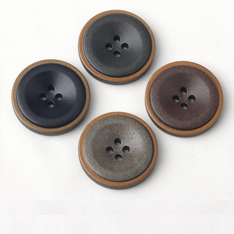 Mixed dark coat buttons, four-hole design, burnt edges