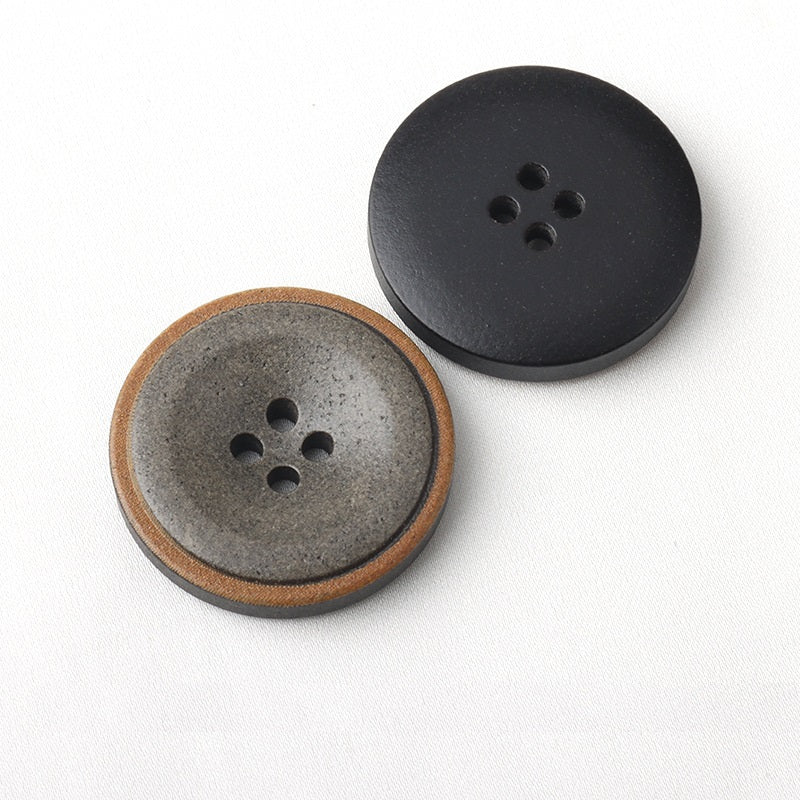 Dark four-hole coat buttons, burnt-edge rim on two styles