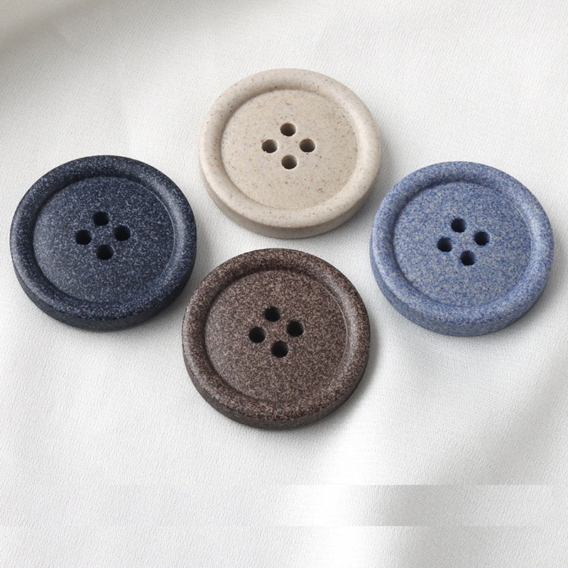 Round four-hole buttons in beige, light blue and coffee, frosted resin faces