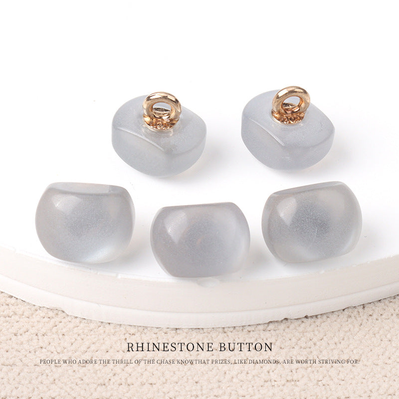 Gray resin pearl buttons with gold metal shanks, 10mm