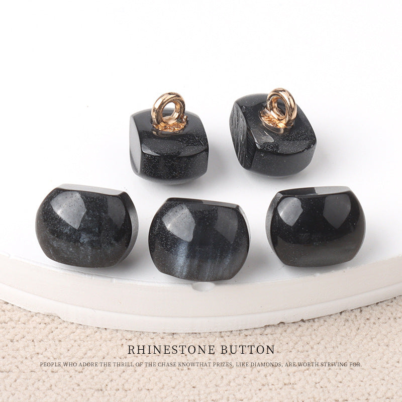 Black resin pearl buttons with gold metal shanks, 10mm