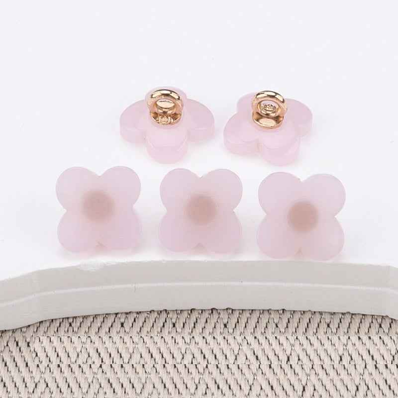 Flower-shaped resin buttons with high shank, light blush/pastel pink, gold-tone loops