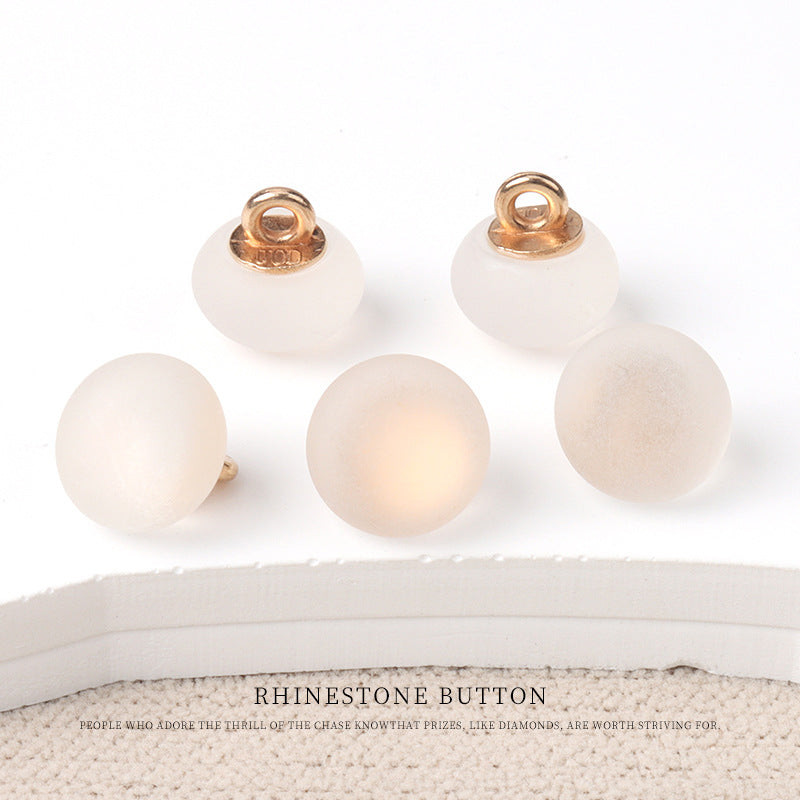 Round matte resin buttons in soft white/cream tones with metal shank—small size.