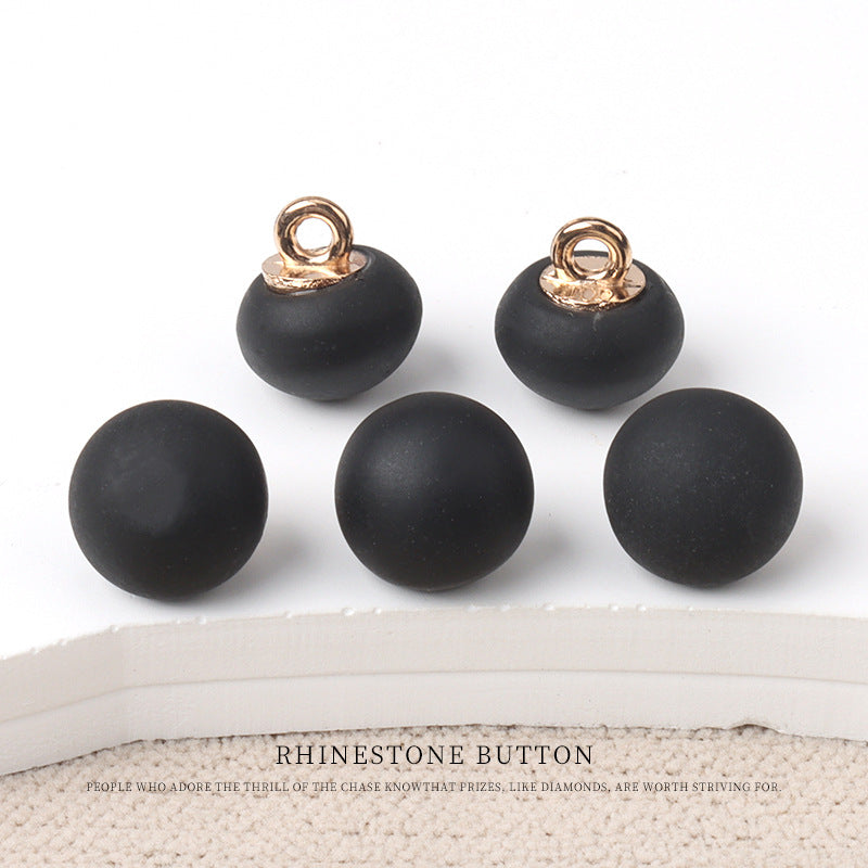 Round matte resin buttons in black with metal shank—small round design.