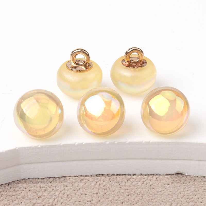 10mm resin mushroom buttons, warm beige/gold tones with gold-tone loop shanks
