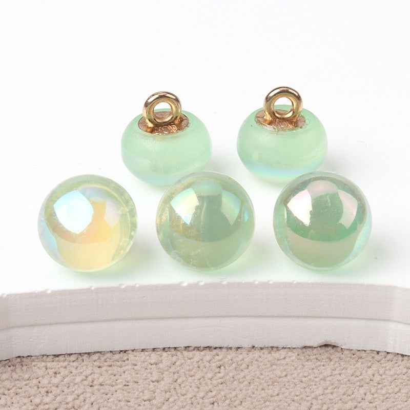 10mm resin mushroom buttons, mint green tones with iridescent finish and gold-tone loops
