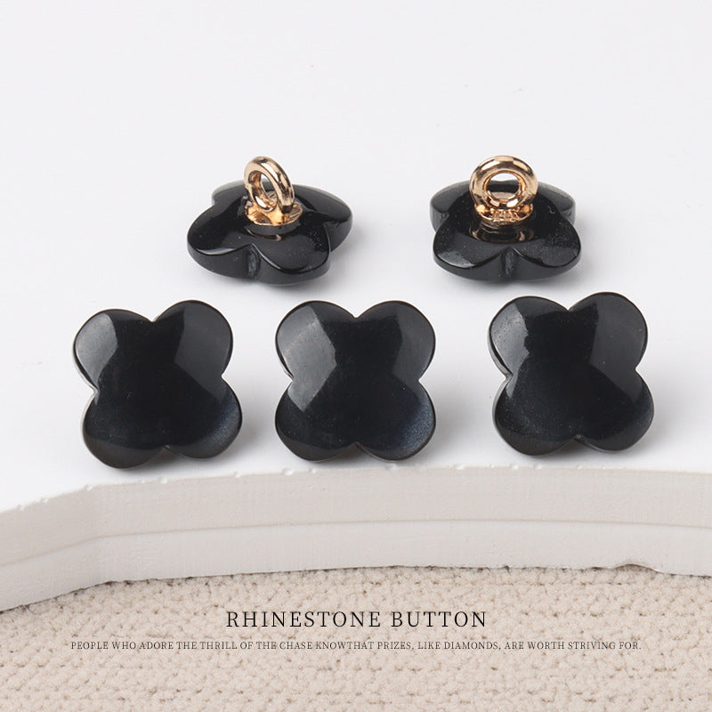 Black flower-shaped resin shank buttons for children's sweaters with rose-gold metal shank loops