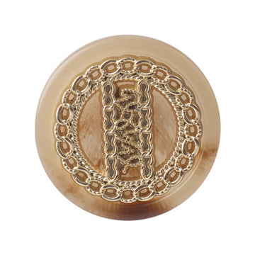 Round double-tone resin metal shank button, ornate gold-tone center detail, front view