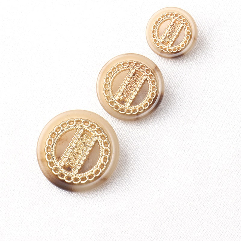 Round double-tone shank buttons with gold filigree trim and decorative front, multiple views