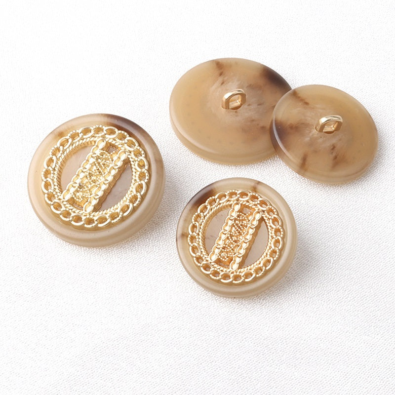 Round double-tone shank buttons with gold filigree trim; includes button backs with loop holes