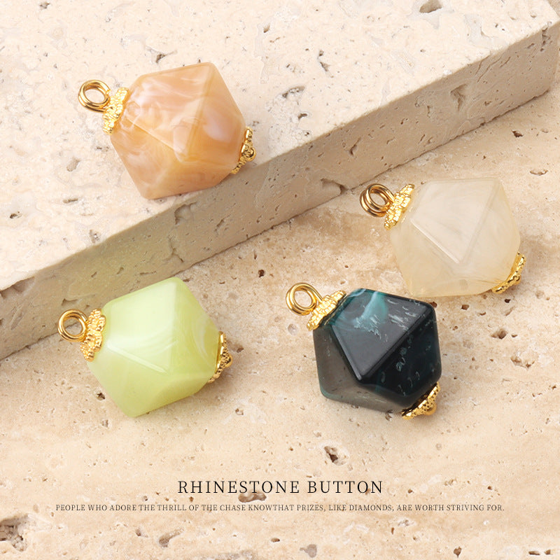 Assorted square acrylic buttons with gold rhinestone flower centers in pale yellow, peach, and dark teal.