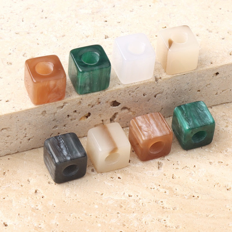 Multicolor square beaded buttons with round holes: orange, green, white, black