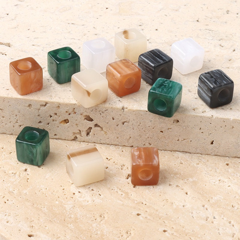 Assorted square beaded buttons with round holes in translucent colors
