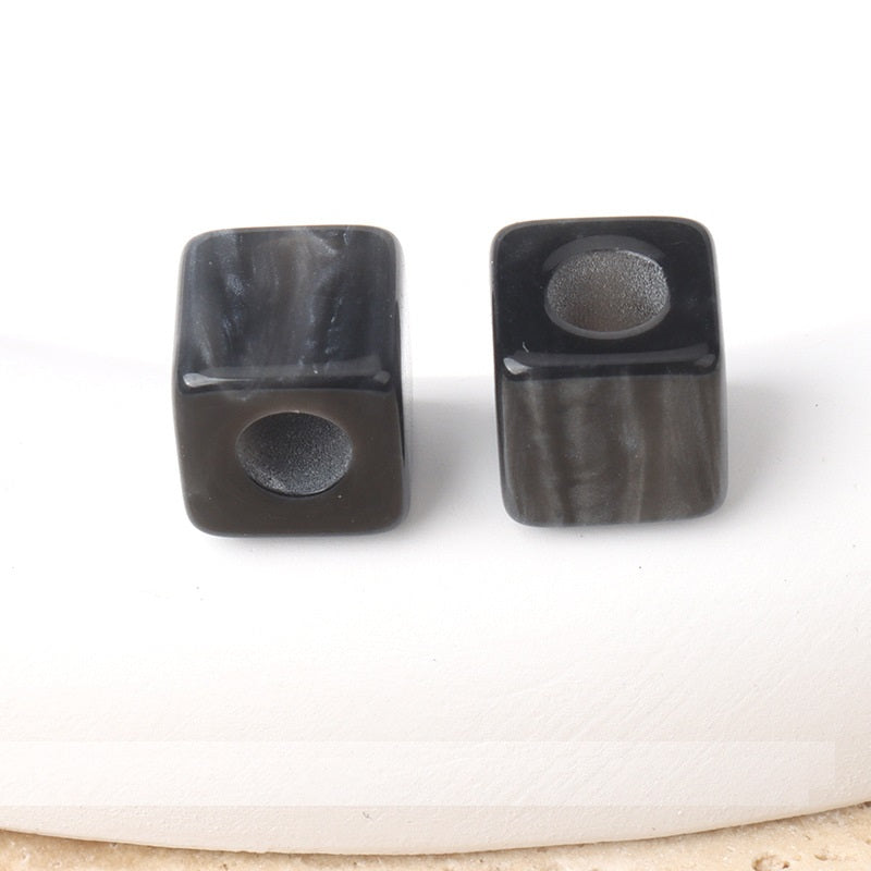 Dark square beaded buttons with round holes, glossy translucent finish
