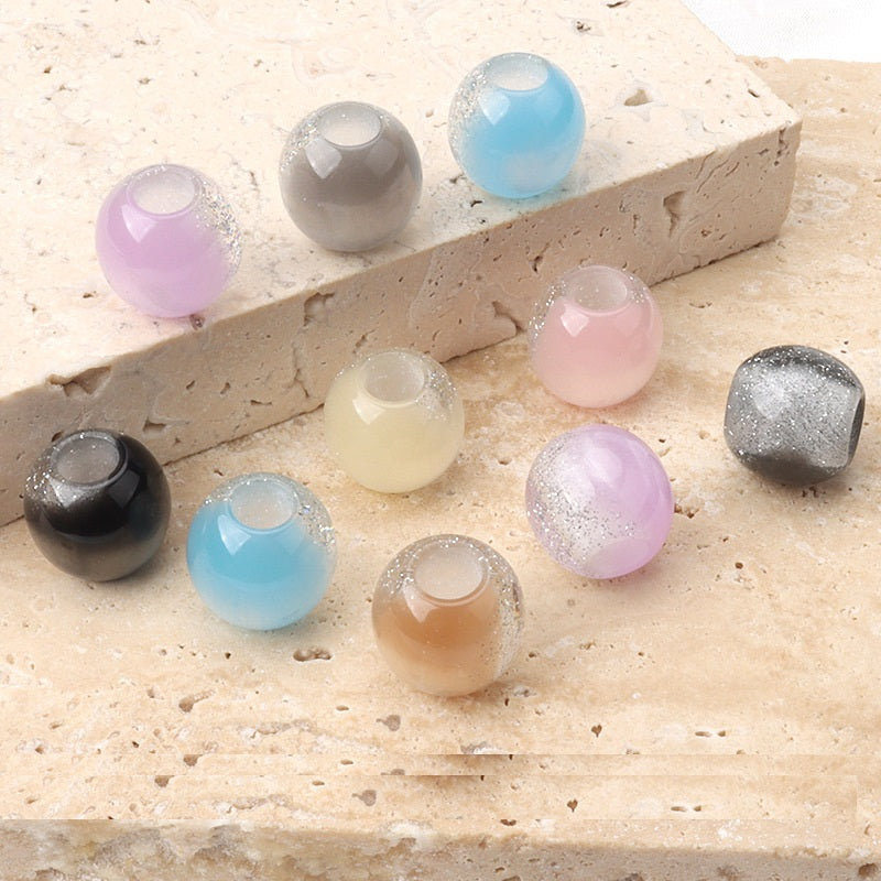 12mm resin pearl-luster beads in multiple colors, visible round shape with center hole
