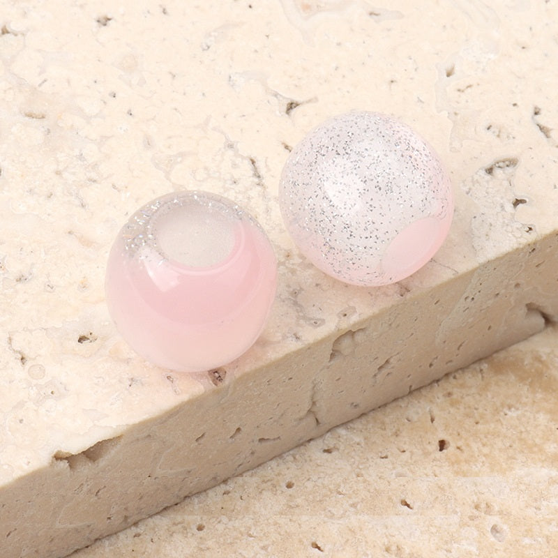 12mm resin beads, pink and pastel pink speckled tones with center hole