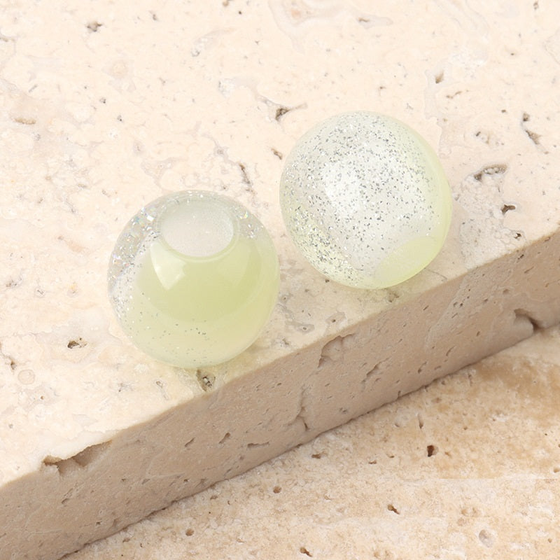 12mm resin beads, pale yellow-green and white-speckled with center hole