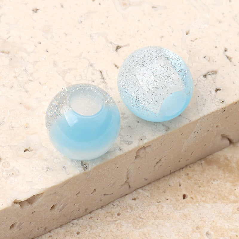 12mm resin beads with pearl luster, light blue and aqua speckled with center hole
