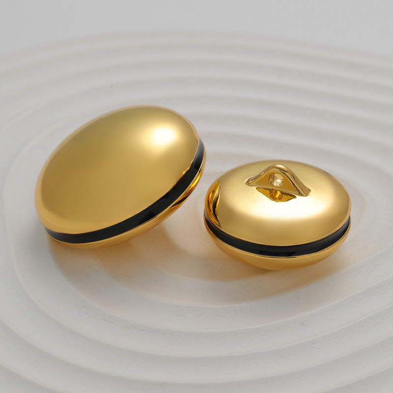 Gold spherical metal buttons with black rim and star-shaped shank details