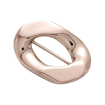 Irregular rose-gold buckle for coats and swimsuits, single piece close-up