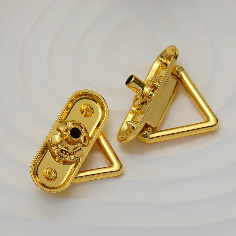 Gold triangular snap metal button set with visible backing and hinge