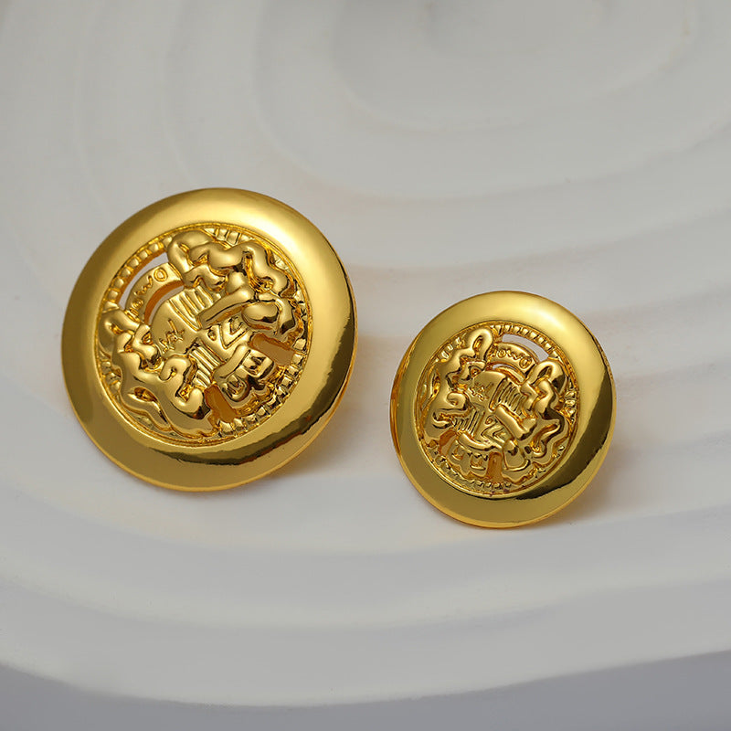 Gold lion crest button pair shown side by side, round metal with relief
