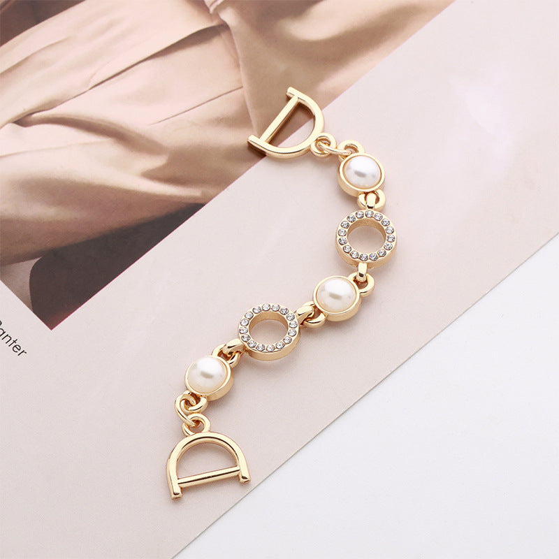 Gold-tone pearl and rhinestone chain buckle with D-ring clasp, decorative clothing accessory