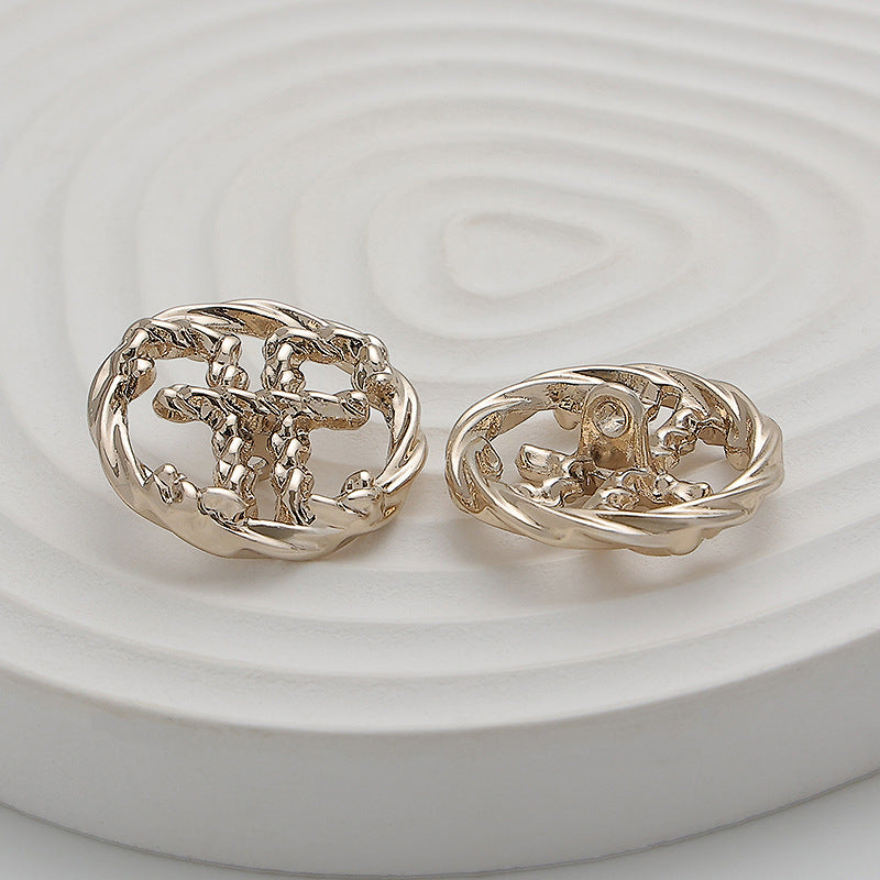 Light gold 23mm double E hollow metal button, openwork front with raised details