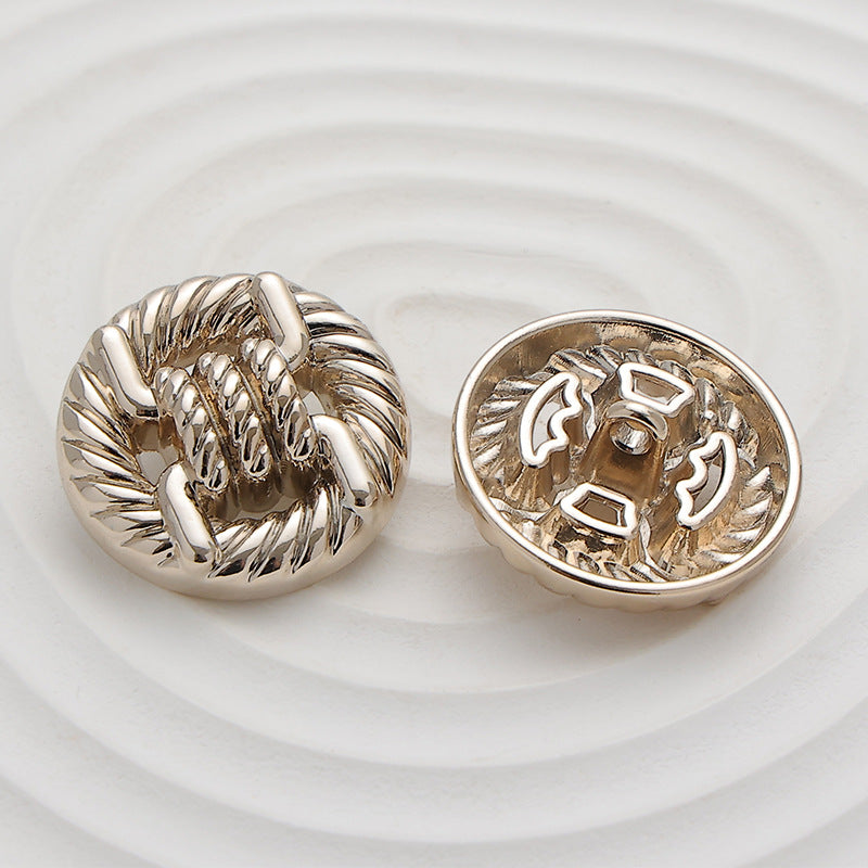Round rope-knot metal button, back view with shank/loop, light gold tone