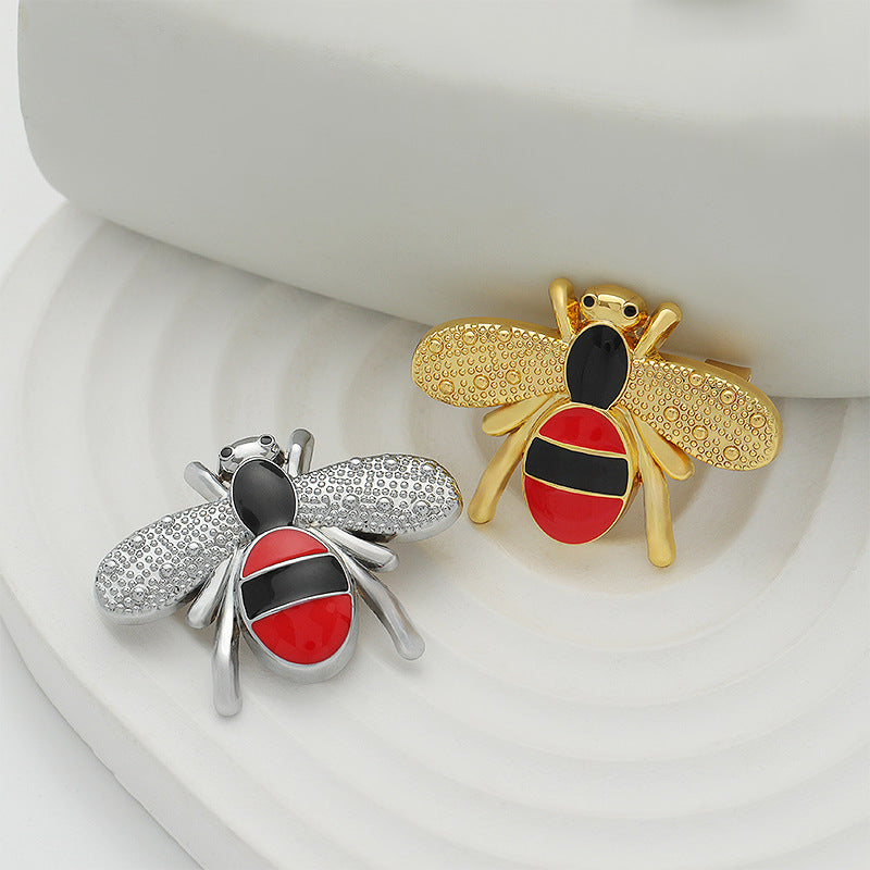 Gold and silver cartoon bee enamel brooches, red-and-black stripes, 2-pack.