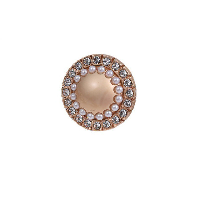Round decorative metal button, gold-tone rim, faux pearls and rhinestone border