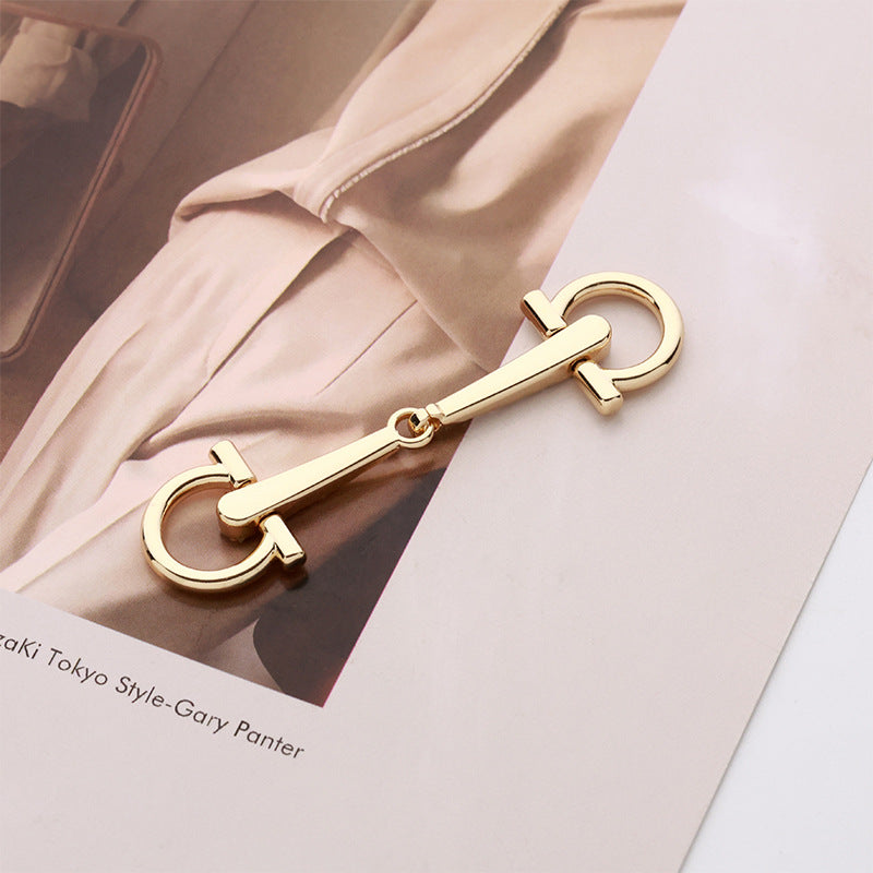 Gold-tone heart buckle pair with crystal rhinestones and curved D-ring frames