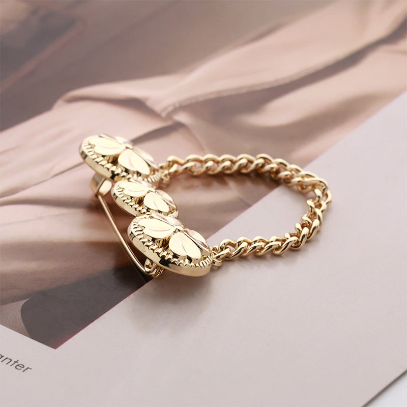 Gold-tone four-leaf clover chain brooch pin with clasp, three disc front