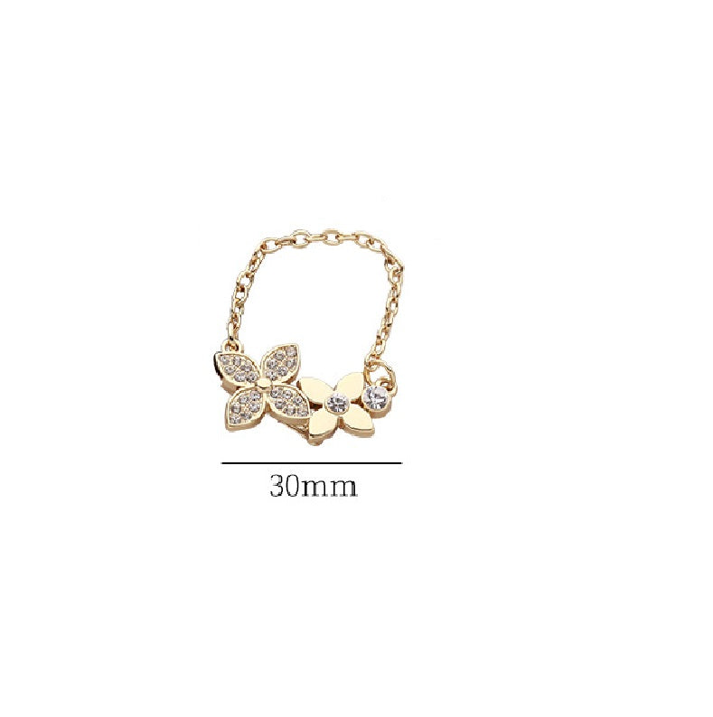 Gold-tone petal flower brooch pin with rhinestone details, 30mm length