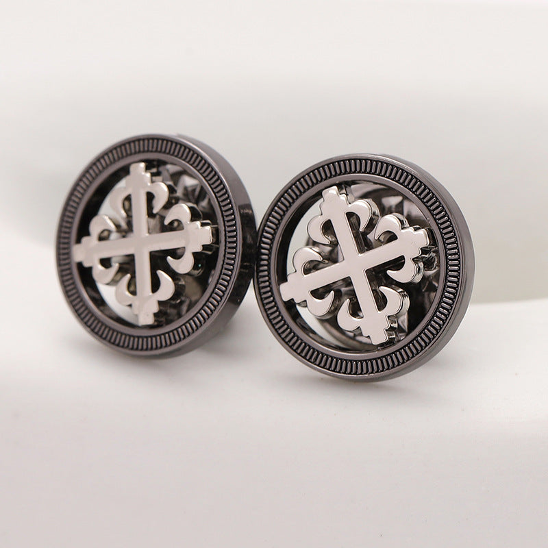 Pair of black hollow geometric cross metal brooches with textured bezel