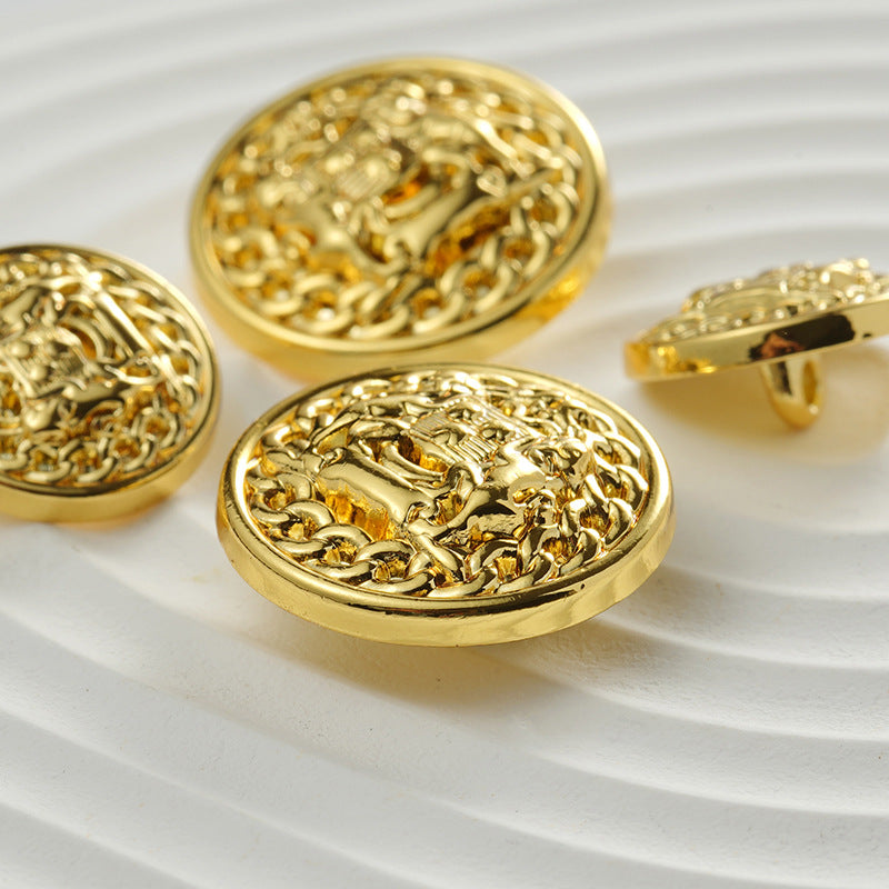 Close-up of golden round coat buttons with double lion emblem, metal