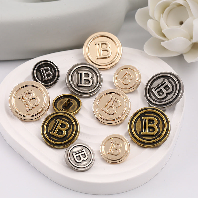 Round letter B metal sewing buttons in black, gold and rose-gold tones